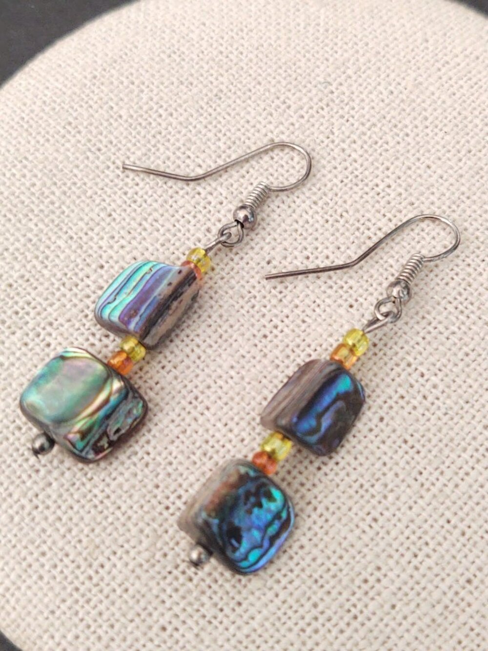 Polished shell beaded earrings with yellow and orange accent beads